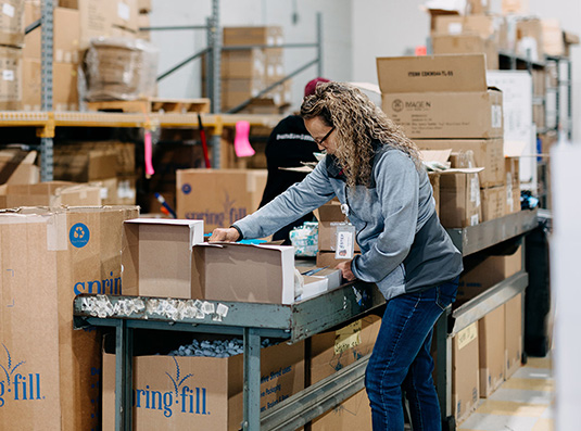 Gifting company employee working in a warehouse.